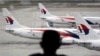 FILE - A fleet of Malaysia Airline planes is seen on the tarmac of the Kuala Lumpur International Airport, in Malaysia, Jan. 29, 2015.